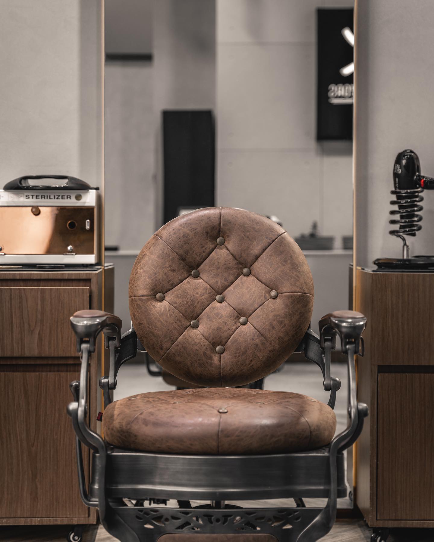 Vintage leather barber chair ready for a client at Scissors and Razors