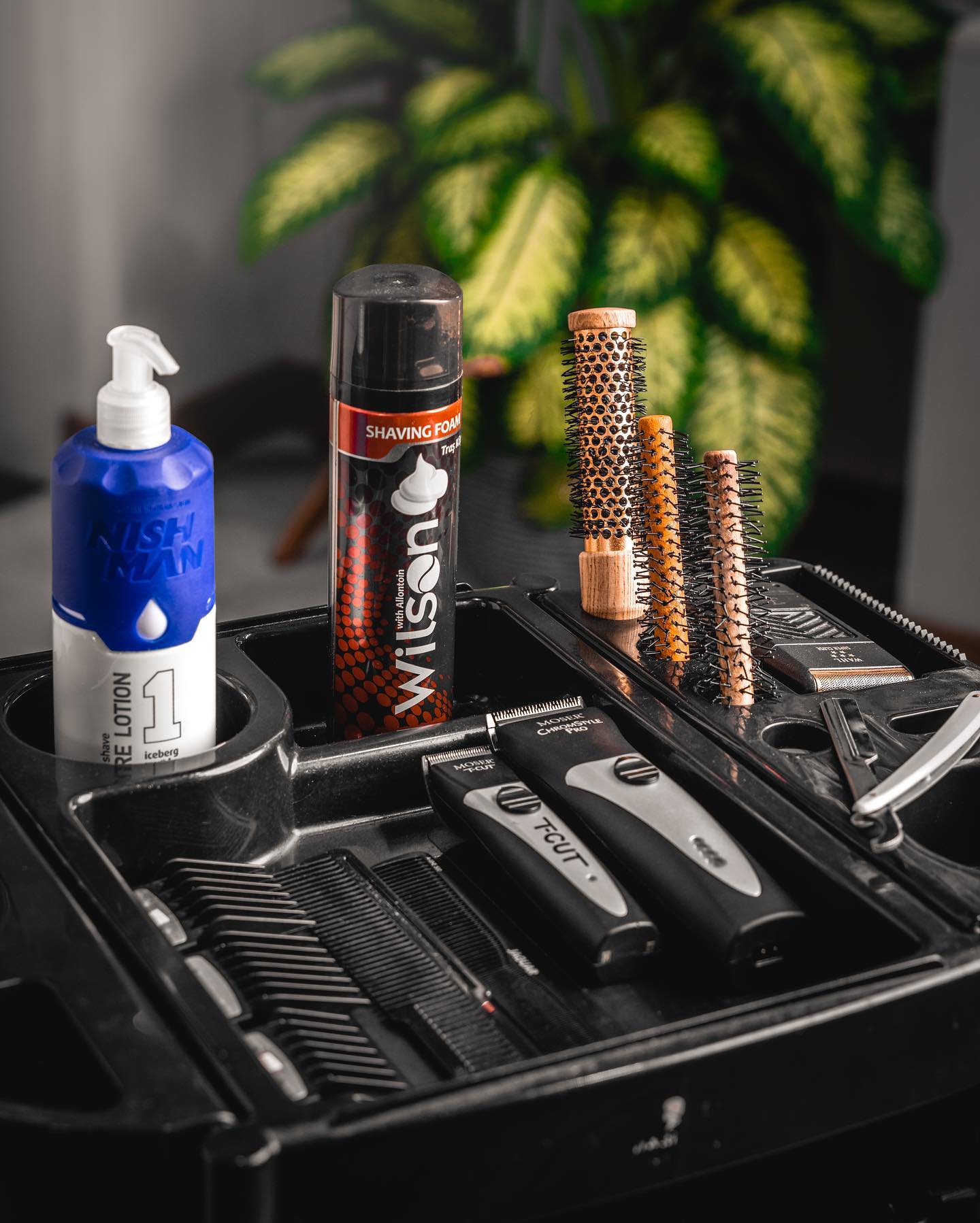 Organized barber tools and shaving products at a Scissors and Razors workstation