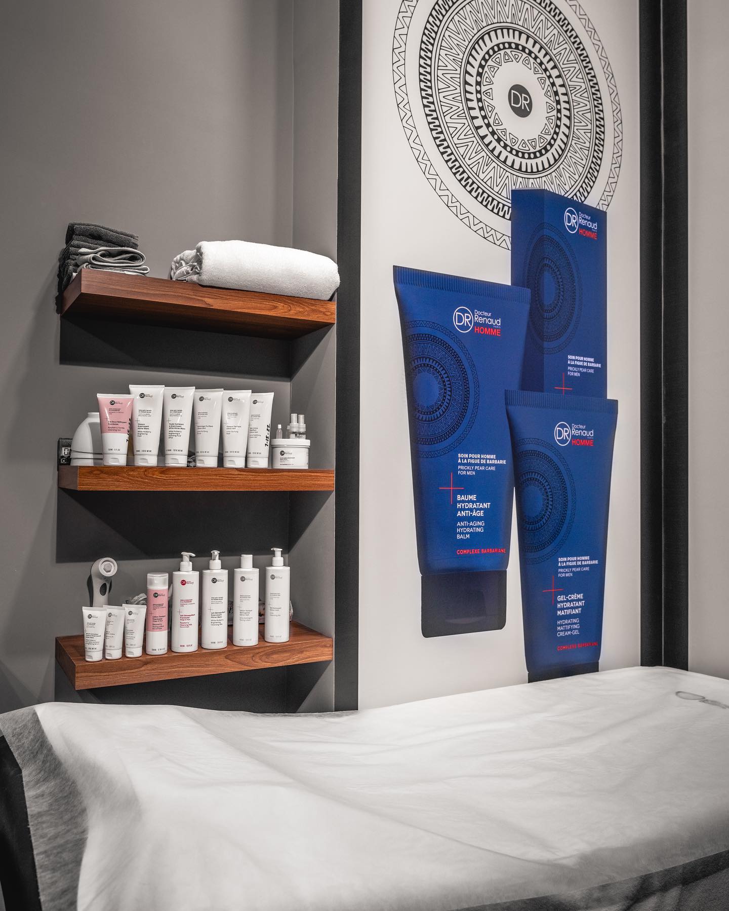 Premium treatment room with skincare products at Scissors and Razors Dubai